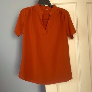 women’s orange blouse
